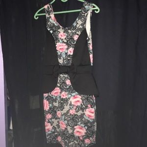 A floral dress with black. Above knee length